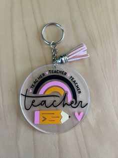 a keychain with the words teacher written on it