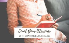 a woman sitting on a couch writing in a notebook with the words count your blessings with gratitude journaling