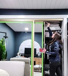 a woman standing in the doorway of a room