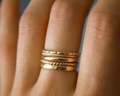 Whimsical 5 band stackers✨ Handmade 14k gold fill soldered bands, which are perfect for everyday wear, and those of you who are minimalistic! Beautiful statement piece, which gives off an etherial and Grecian feel 🦋✨ MATERIAL: 14/20 (karat/purity) gold fill THICKNESS: each band varies from 1- 2.31 mm *will NOT tarnish Each are uniquely hand crafted!💕 Stacked Yellow Gold Wedding Jewelry, Everyday Gold Stackable Bands, Stackable Band Gold Rings, Everyday Stackable Gold Bands, Stackable Gold Band Rings, Thick Gold Ring, Textured Gold Ring, Garnet Ring Silver, Vegan Jewelry