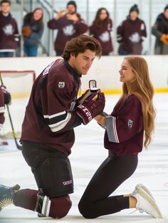 a man and woman standing next to each other in front of an ice hockey net