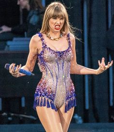 taylor swift performs on stage at the super bowl