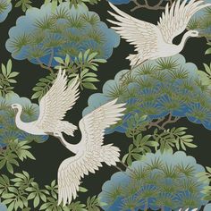 two white birds flying over green leaves on a blue background