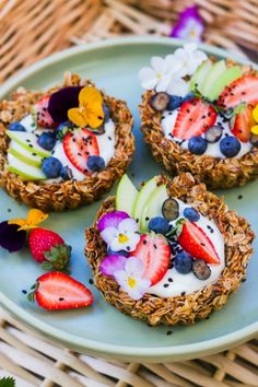 three desserts with strawberries, apples, and blueberries are on a plate