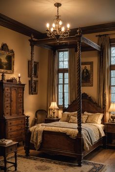 a canopy bed sitting in a bedroom next to two windows