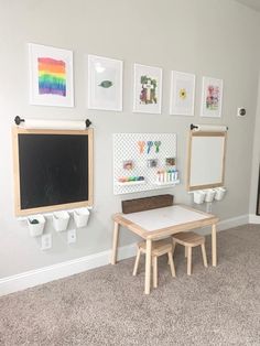 a child's playroom with two tables and chalkboard