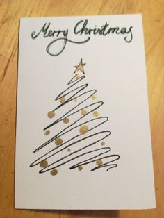 a card with a christmas tree drawn on it