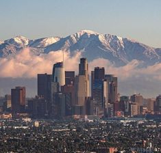 the city is surrounded by snow capped mountains