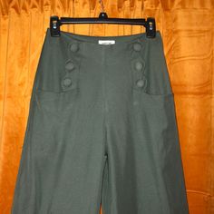 Wide Leg Dress Pants With Cute Scallop Pocket And Button Side Detail. Side Zipper. Size Small/ 4, Length Of 44 In From Waist To Bottom Leg Hem, 12 Inch Wide Leg. Unworn, Nwt. From Unique Vintage, Royal Monk Tags. Dry Clean Only, 100% Poly Spring Wide-leg Pants With Button Cuffs, Cotton Wide Leg Pants With Buttons For Spring, Spring Cotton Wide Leg Pants With Buttons, High Waist Cotton Wide Leg Pants With Buttons, Spring Wide Leg Cotton Pants With Buttons, High-waist Wide Leg Cotton Pants With Buttons, High Waist Bottoms With Side Buttons, Spring Green Button-up Pants, Retro Spring Bottoms With Buttons