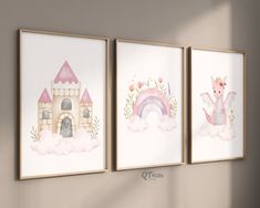 three framed pictures hanging on the wall in front of a window with a castle and rainbow