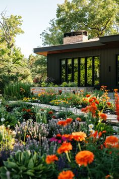 an image of a garden setting with flowers in the foreground and trees in the background