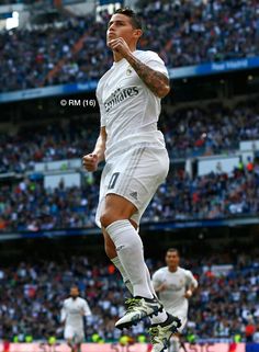 the soccer player is jumping up in the air to celebrate his team's victory