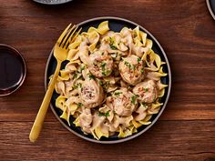 a plate of pasta with meatballs and sauce