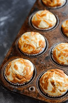 a muffin tin filled with freshly baked cupcakes