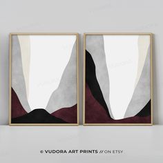 two framed art prints on a wall