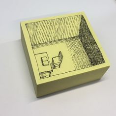 a yellow box with a drawing on it