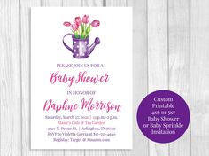 a baby shower is shown with pink tulips in a teapot on it