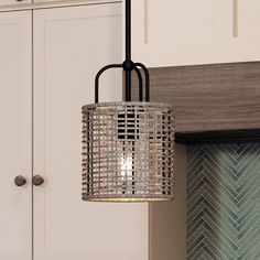 An Urban Ambiance UHP3962 Bohemian Pendant, a gorgeous lighting fixture from the Taree Collection, hanging over a kitchen counter. Pendant Over Bathtub, Luxury Bohemian, Indoor Chandelier, Contemporary Traditional, Rattan Shades, Urban Industrial, Midnight Black, Sloped Ceiling, Vintage Lighting