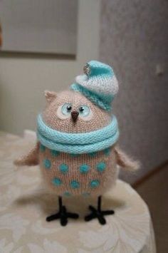 a knitted owl sitting on top of a table