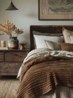 a bed with pillows and blankets in a bedroom