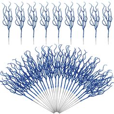 the blue branches are arranged in rows to form an intricate fan shaped arrangement on top of each other