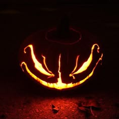 a pumpkin carved to look like it has been carved into the shape of a bird