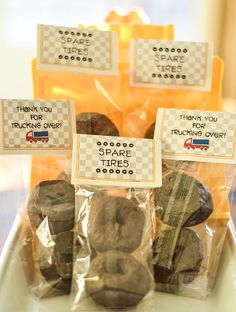 donuts are wrapped in plastic bags with thank you teacher signs on them for teachers