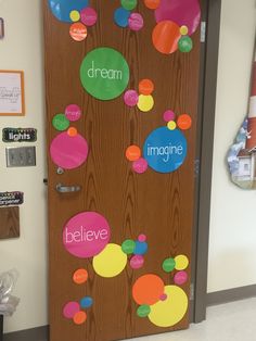 a door decorated with colorful circles and words