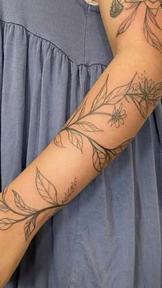 a woman's arm with flowers on it