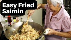 an old woman cooking food in a wok on the stove with text overlay that reads easy fried salmon