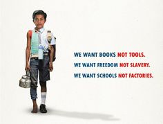 a young boy standing in front of a white wall with words written on it that say we want books not tools