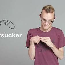 a man wearing glasses looking at his cell phone with the words ask sucker above him