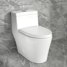 a white toilet sitting on top of a stone floor