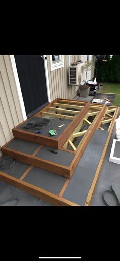 an outdoor patio being built with concrete and wood