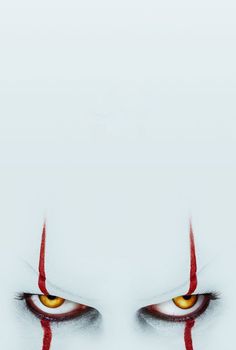 an evil looking face with yellow eyes and red blood on it's forehead, in the middle of a white background