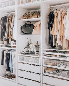 an organized closet with clothes, shoes and handbags on shelve shelves in white