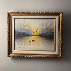 a painting hanging on the wall with two ducks in it's watercolors