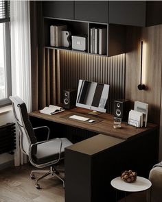 an office with a desk, chair and bookshelf next to a large window