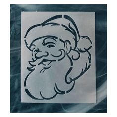 a drawing of a santa clause on a piece of white paper with black ink in the shape of a face