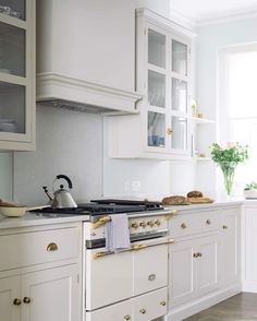 an image of a kitchen with white cabinets