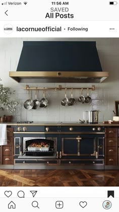 an old fashioned oven with pots and pans hanging from the wall in a kitchen