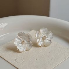 Elevate your style with these stunning Mother of Pearl Flower Ear Studs. Crafted with silver and gold plating, they exude a romantic and elegant vibe perfect for any special occasion. Experience the luxury and beauty of these exquisite earrings. Materials:  Mother of Pearl   925 Silver Elegant Flower Jewelry For Spring, Elegant Flower Decorated Jewelry For Anniversary, Elegant Spring Flower Jewelry, Pearl White Flower Earrings For Formal Occasions, Elegant White Jewelry For Spring, Elegant White Spring Jewelry, White Classic Flower Earrings For Anniversary, Classic White Flower Earrings For Anniversary, Elegant Spring Earrings For Anniversary