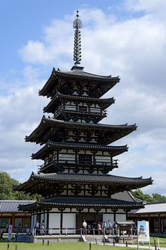 a tall building with many windows on top of it