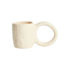 a white ceramic mug with a curved handle