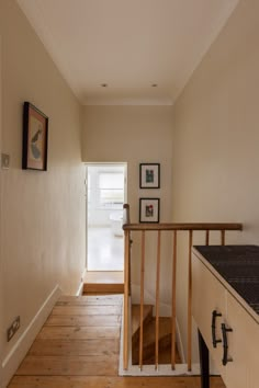 the hallway is clean and ready to be used as a place for pictures or other things