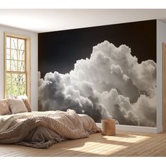 a bedroom scene with focus on the bed and clouds