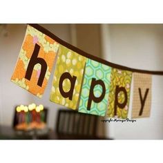 a happy birthday banner hanging from a dining room table