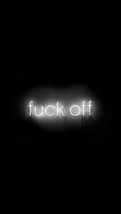 a neon sign that reads,'f k off'in white letters on a black background