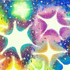 an abstract painting with different colors and shapes in the center, including stars on it