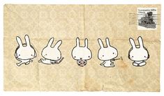 an old postcard with four bunnies in the shape of rabbits on it's side